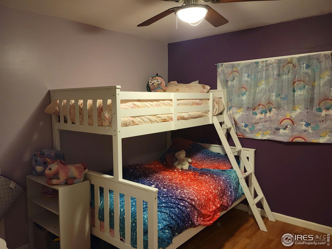 177 Delaware Drive Sterling, CO 80751 - Photo 10 of 13 a bed sitting in a bedroom next to a window