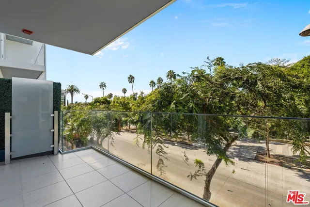 a view of a balcony with an outdoor space
