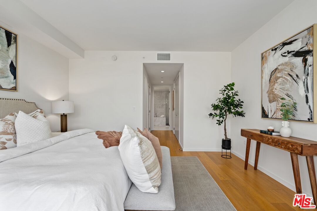1705 Ocean Avenue, Unit 206 Santa Monica, CA 90401 - Photo 17 of 26 a bedroom with a bed and a dresser