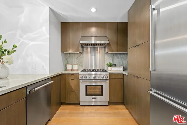 a kitchen with a stove and a refrigerator