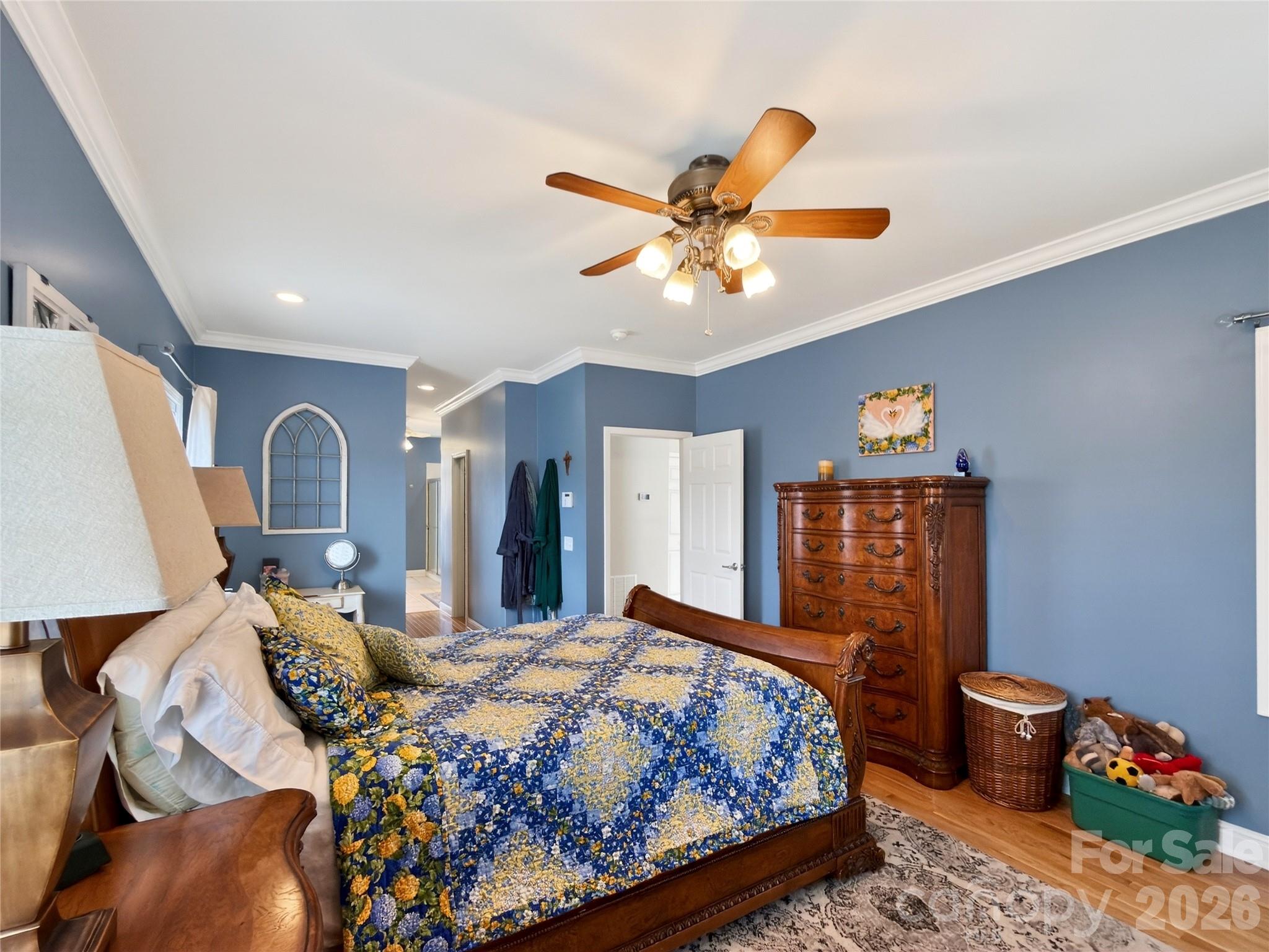 3275 Hanging Rock Road Spruce Pine, NC 28777 - Photo 14 of 48 a bedroom with a bed and a chandelier