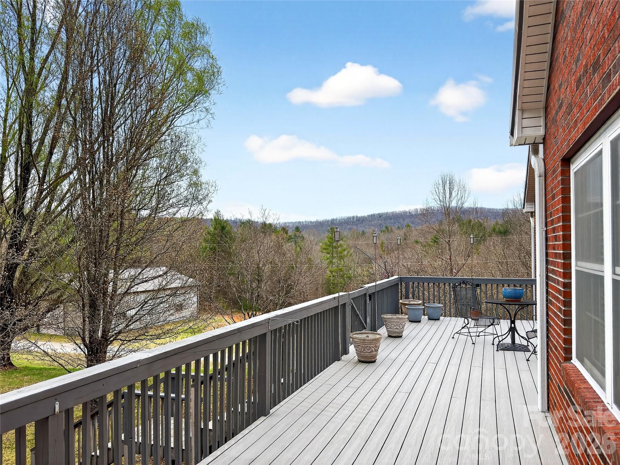 3275 Hanging Rock Road Spruce Pine, NC 28777 - Photo 25 of 48 a view of a balcony with mountain view and wooden floor