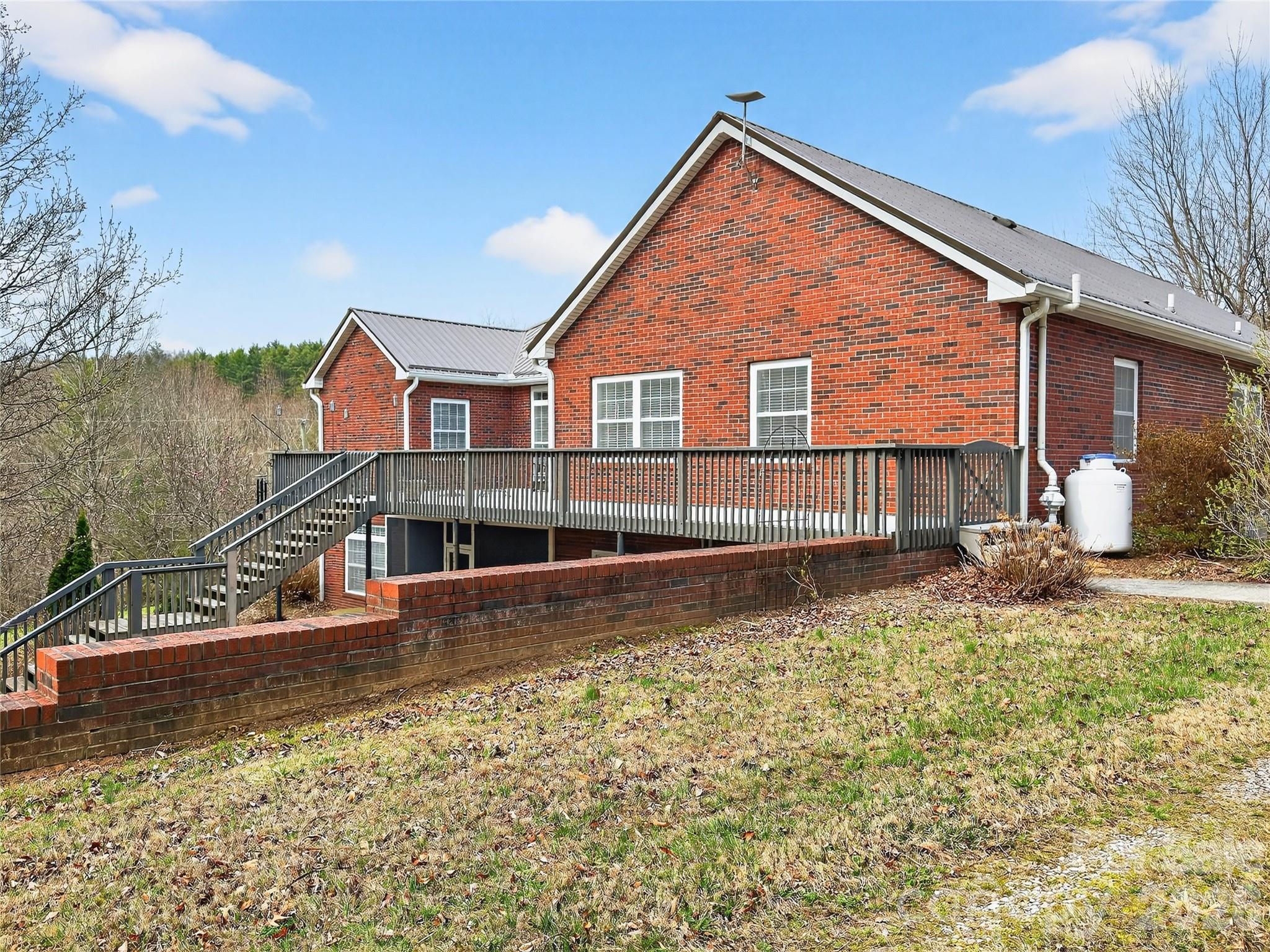 3275 Hanging Rock Road Spruce Pine, NC 28777 - Photo 26 of 48 front view of a house with a yard