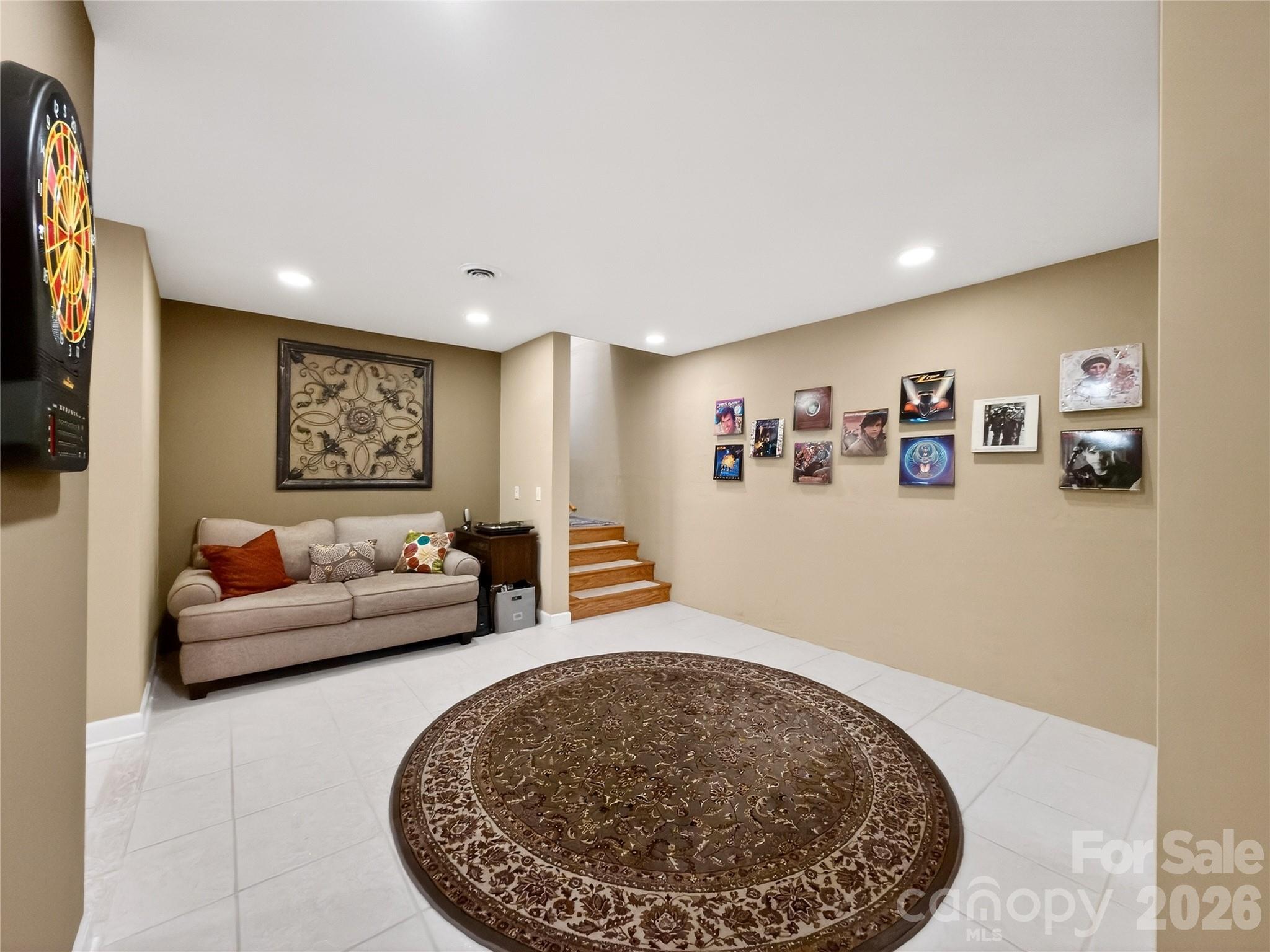 3275 Hanging Rock Road Spruce Pine, NC 28777 - Photo 27 of 48 a living room with furniture and a flat screen tv