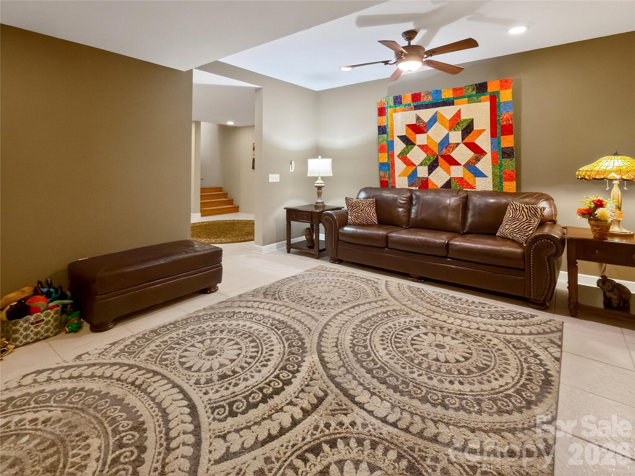 3275 Hanging Rock Road Spruce Pine, NC 28777 - Photo 29 of 48 a living room with furniture a rug and a lamp