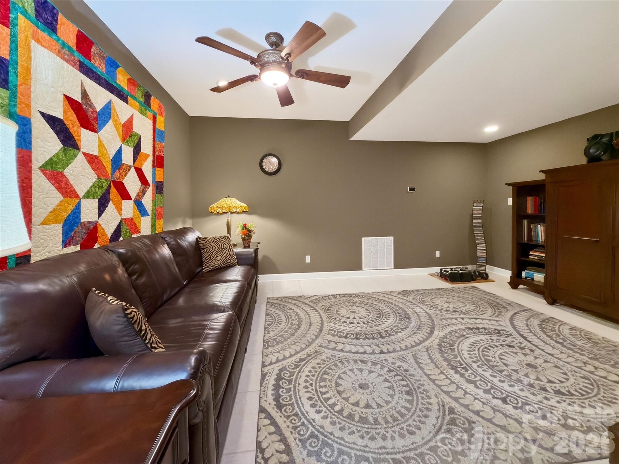 3275 Hanging Rock Road Spruce Pine, NC 28777 - Photo 30 of 48 a living room with a couch and a chandelier
