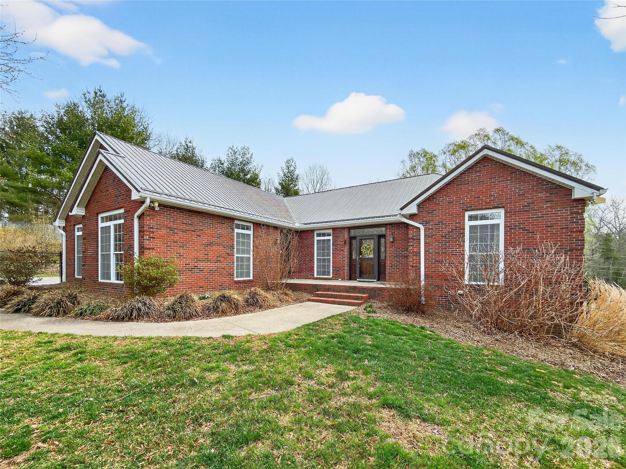 3275 Hanging Rock Road Spruce Pine, NC 28777 - Photo 3 of 48 a front view of house with yard and green space