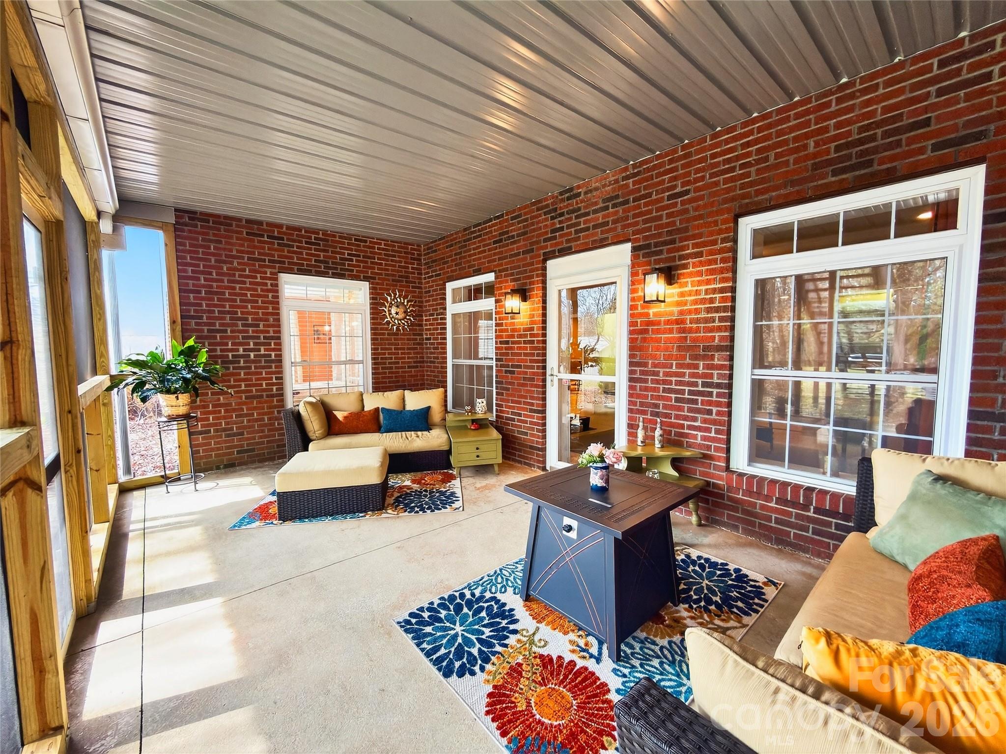3275 Hanging Rock Road Spruce Pine, NC 28777 - Photo 38 of 48 a living room filled with furniture and floor to ceiling windows
