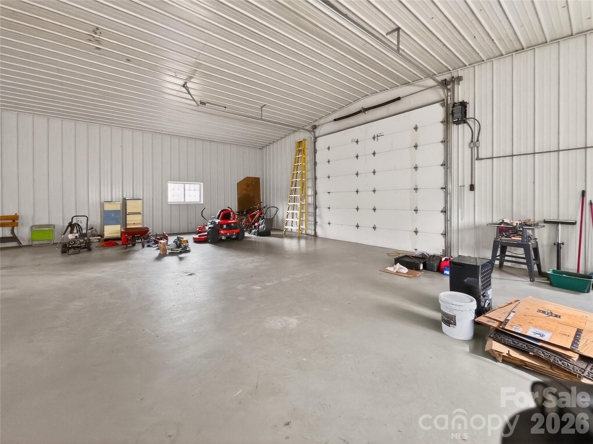 3275 Hanging Rock Road Spruce Pine, NC 28777 - Photo 45 of 48 a living room with furniture and a chandelier