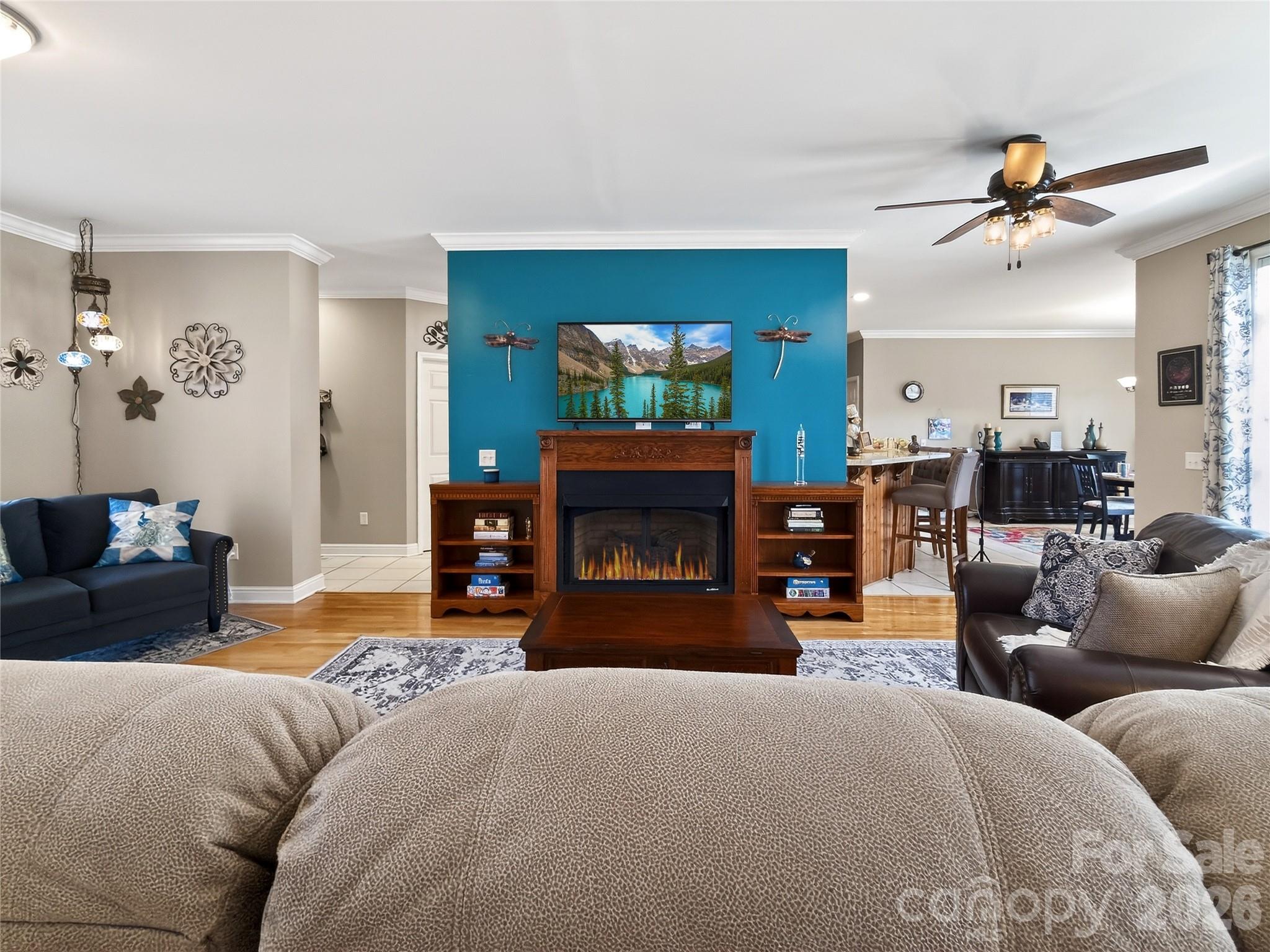 3275 Hanging Rock Road Spruce Pine, NC 28777 - Photo 5 of 48 a living room with furniture a fireplace and a flat screen tv