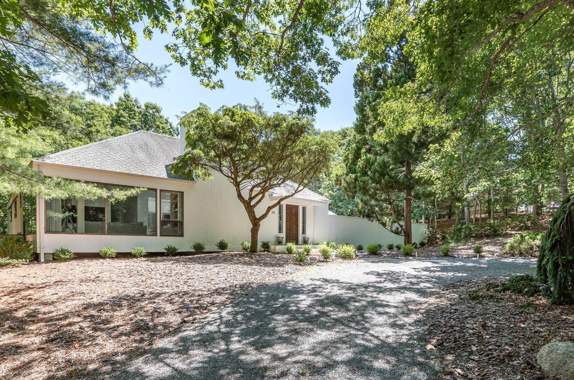 a view of house with a tree in front