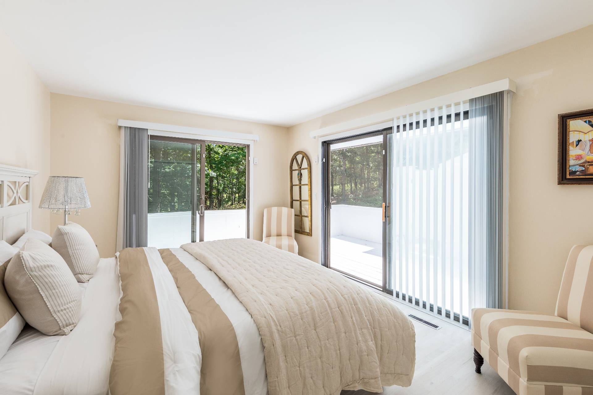 34 Rivers Road East Hampton, NY 11937 - Photo 11 of 17 a bedroom with a bed and glass window