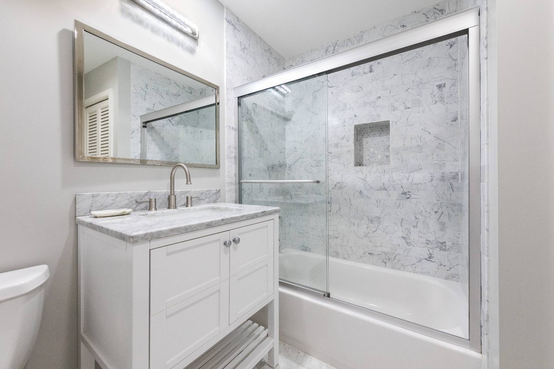34 Rivers Road East Hampton, NY 11937 - Photo 12 of 17 a bathroom with a granite countertop sink mirror toilet and bathtub