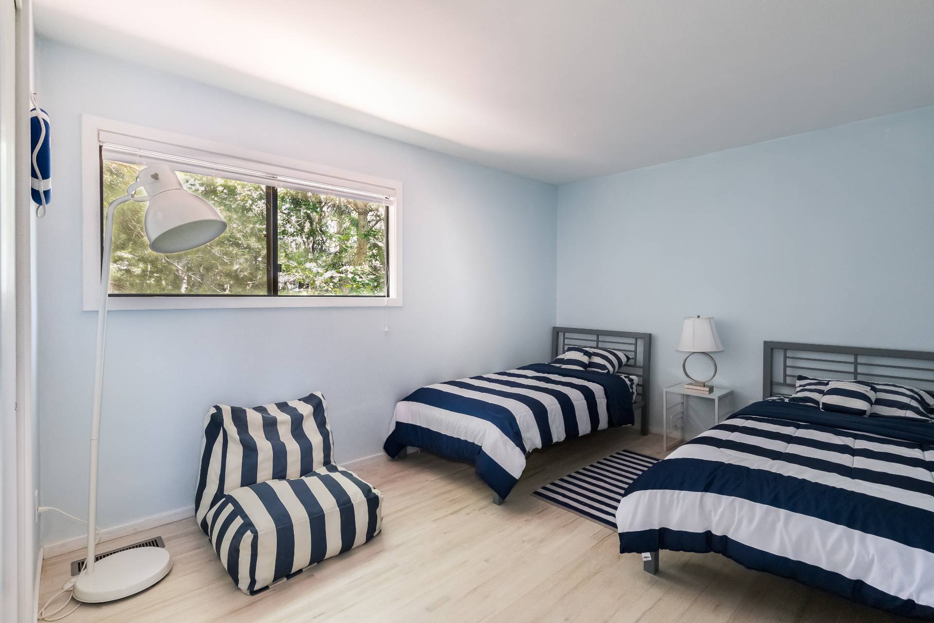 34 Rivers Road East Hampton, NY 11937 - Photo 14 of 17 a bedroom with two beds and a large window