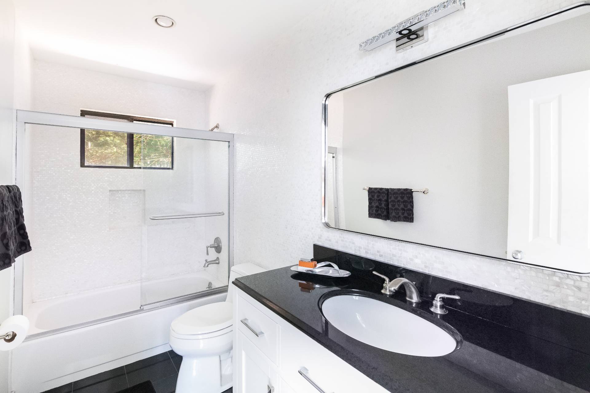 34 Rivers Road East Hampton, NY 11937 - Photo 15 of 17 a bathroom with a granite countertop sink toilet a mirror and shower