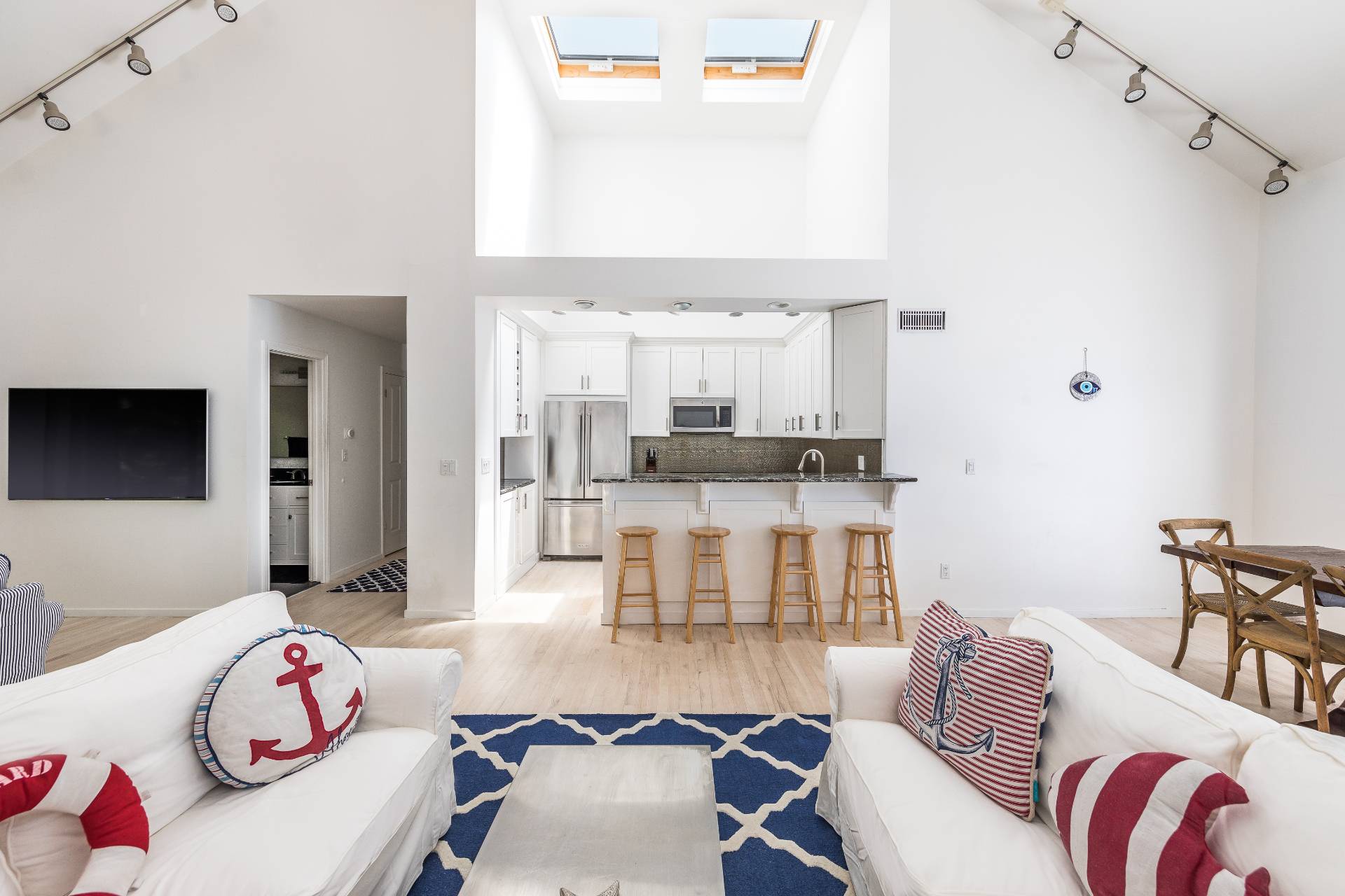 34 Rivers Road East Hampton, NY 11937 - Photo 3 of 17 a living room with furniture and a flat screen tv