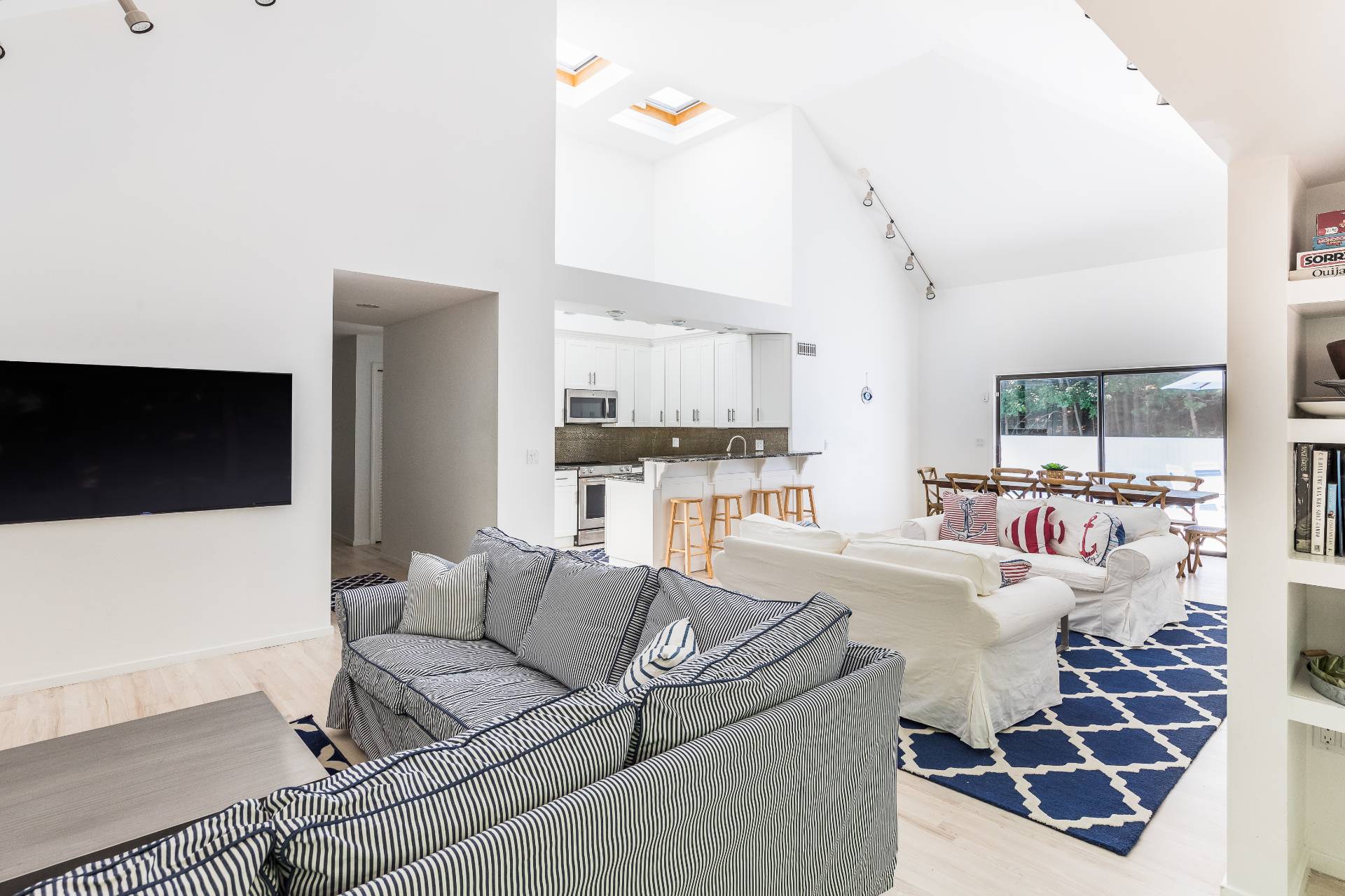 34 Rivers Road East Hampton, NY 11937 - Photo 5 of 17 a living room with furniture and a flat screen tv