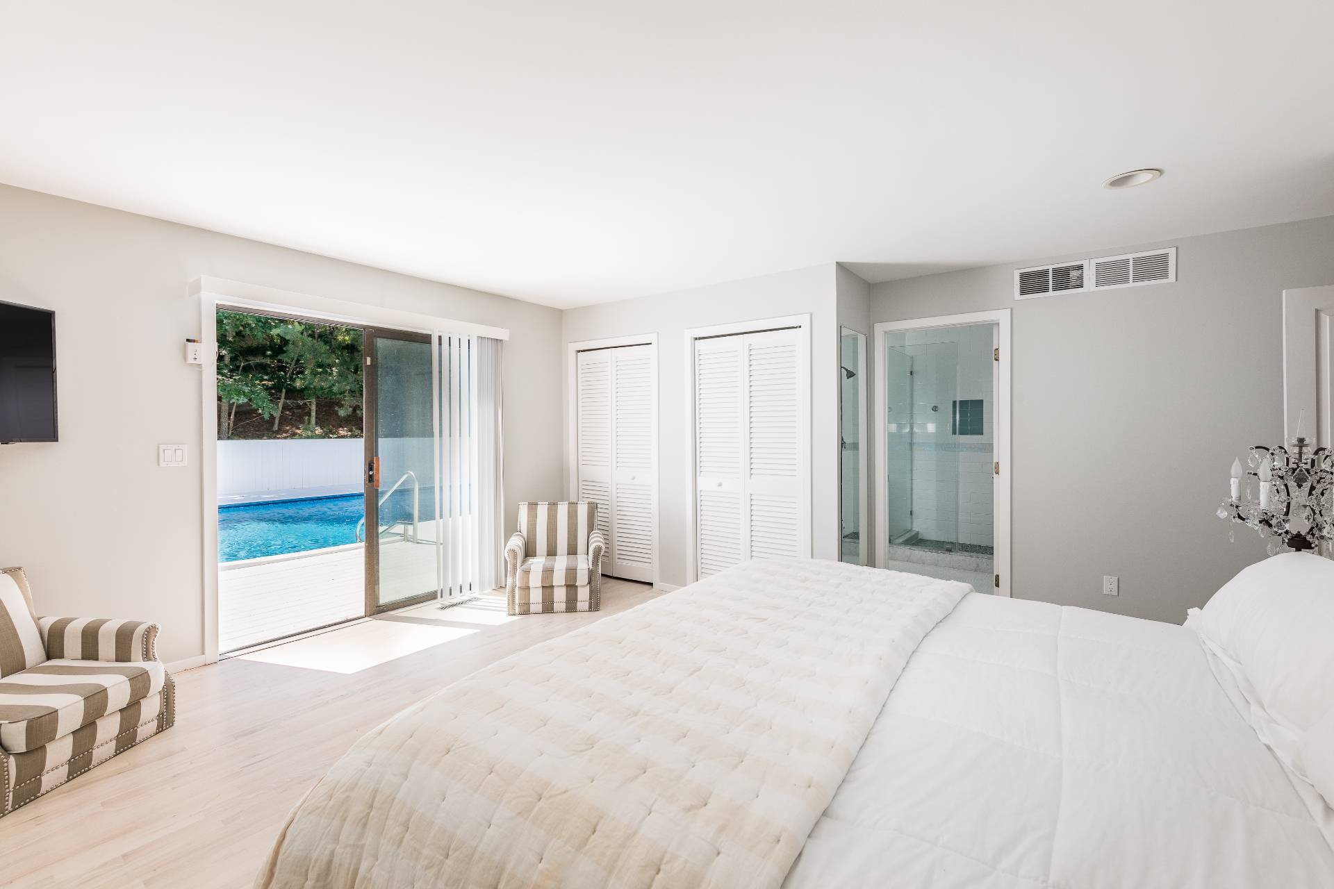 34 Rivers Road East Hampton, NY 11937 - Photo 8 of 17 a bedroom with a bed and a large window