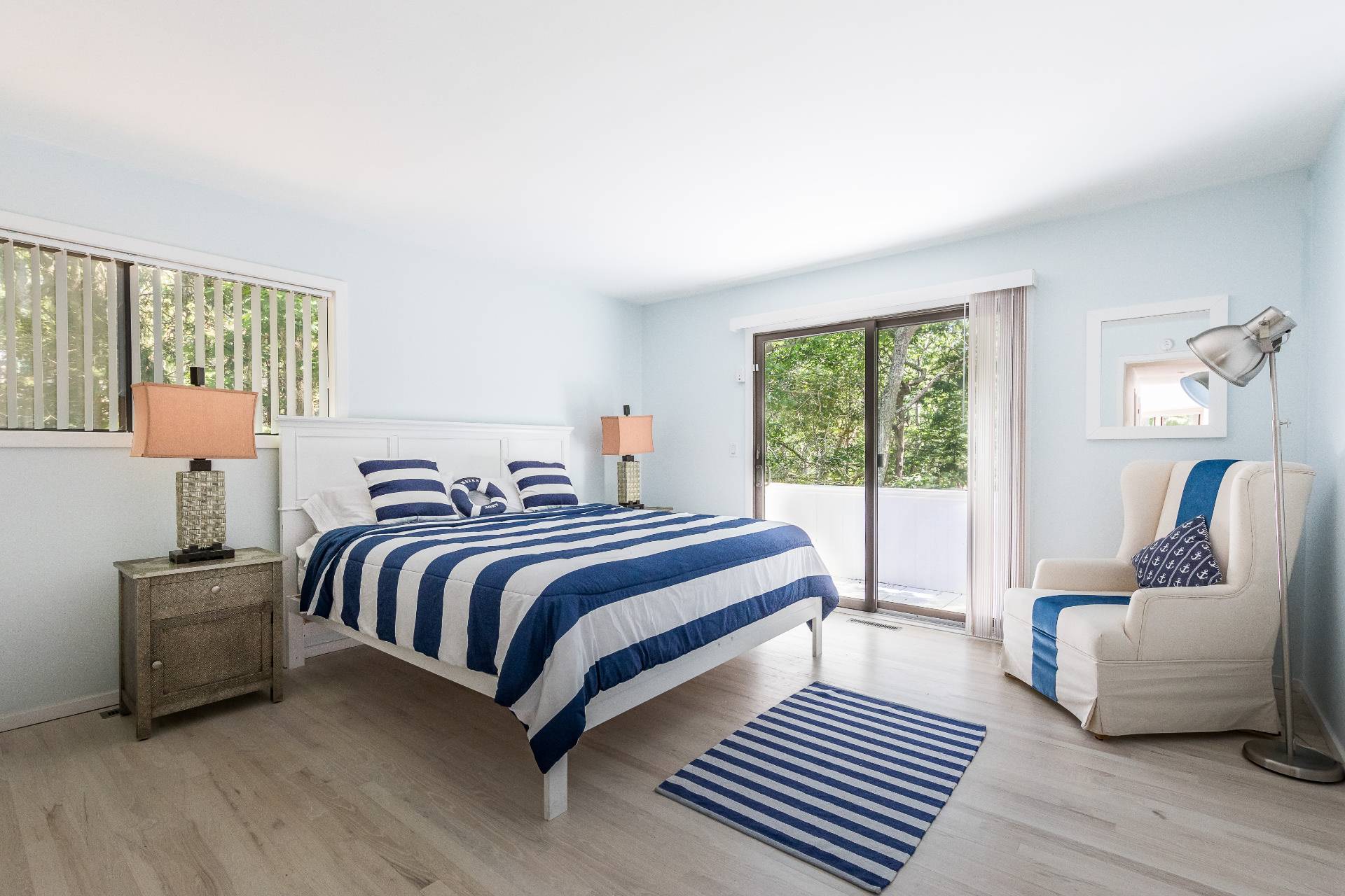 34 Rivers Road East Hampton, NY 11937 - Photo 10 of 17 a spacious bedroom with a bed and wooden floor