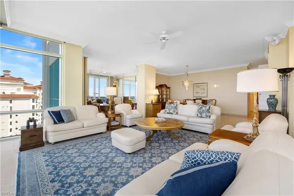 a living room with furniture and a lamp