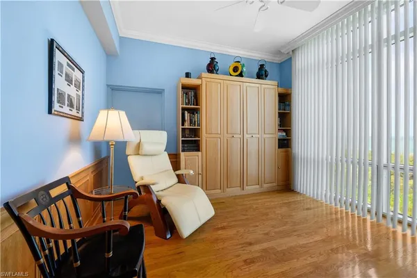 a bedroom with furniture and a window