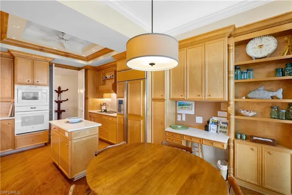 a bedroom with a bed and a table in it