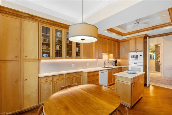a kitchen with stainless steel appliances granite countertop a sink and cabinets
