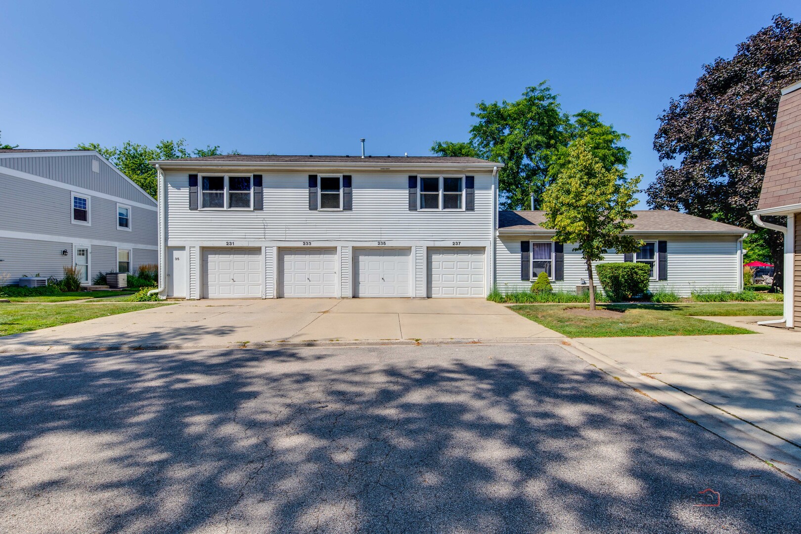 a view of house with outdoor space and street view