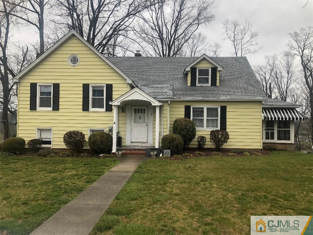 9 Carpender Road New Brunswick, NJ 08901 - Photo 1 of 15 a front view of a house with a yard