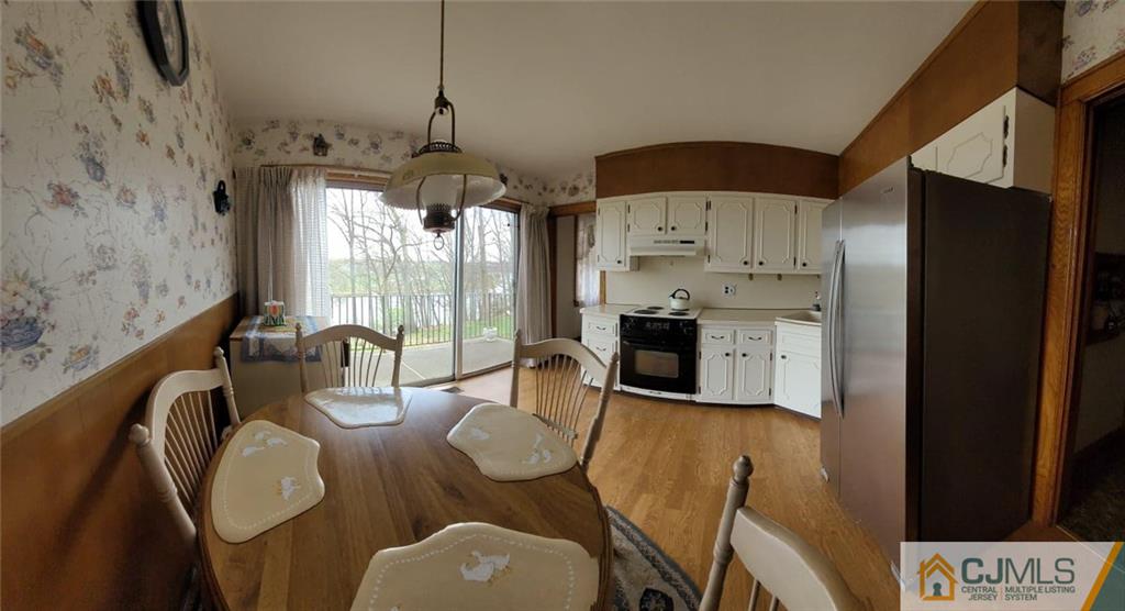 9 Carpender Road New Brunswick, NJ 08901 - Photo 15 of 15 a dining room with furniture a window and a chandelier
