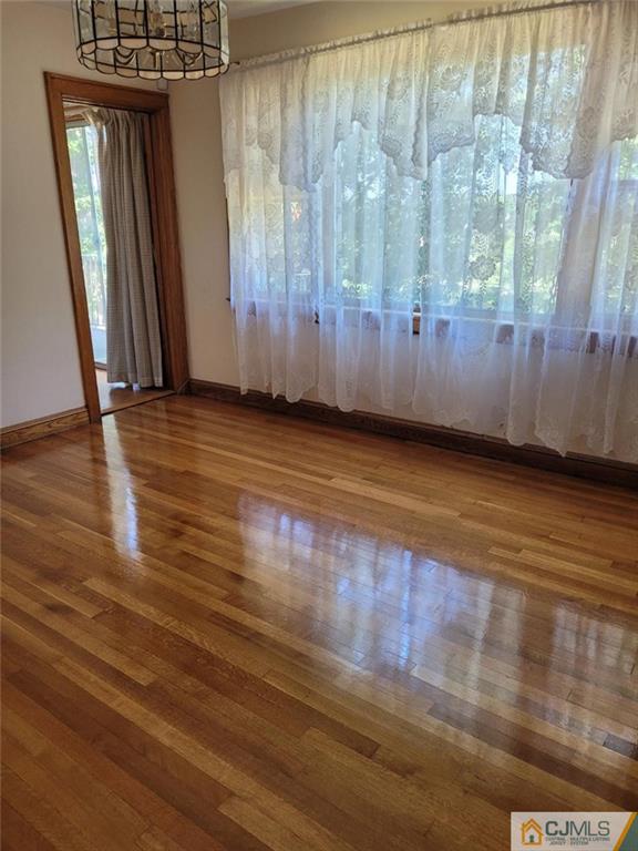 9 Carpender Road New Brunswick, NJ 08901 - Photo 7 of 15 a view of a livingroom with wooden floor and stairs