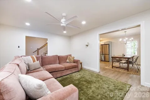 a living room with furniture and a rug