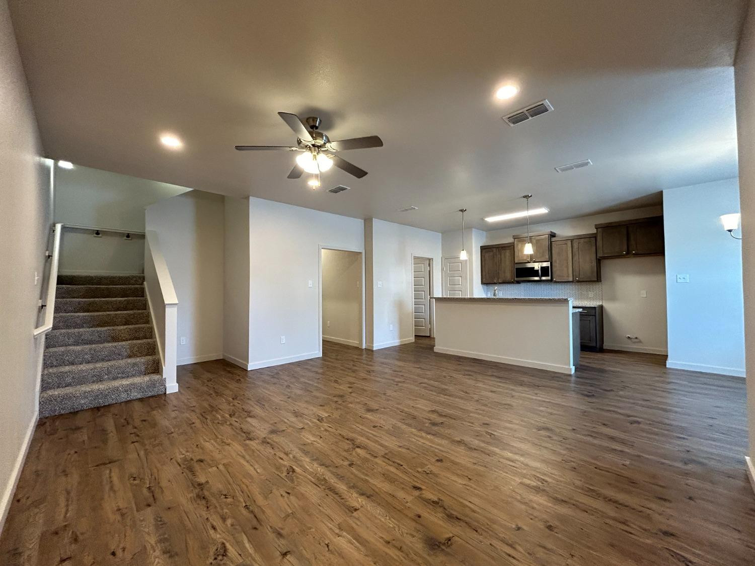 2603 135th Street Lubbock, TX 79423 - Photo 2 of 12 a view of a kitchen with a sink and a stove top oven