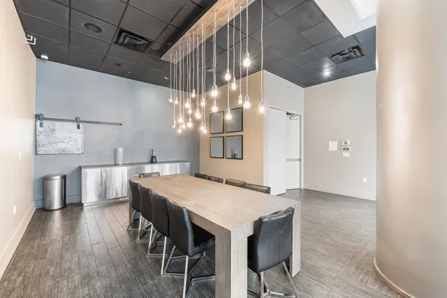 a kitchen with a table and chairs in it