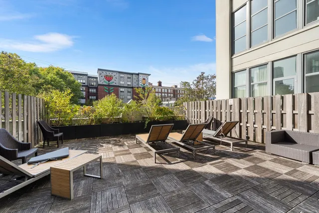 a view of a chairs and table in patio