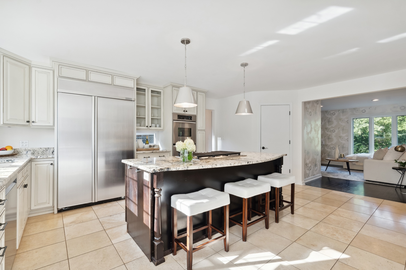 811 South Ridge Road Lake Forest, IL 60045 - Photo 14 of 47 a kitchen with stainless steel appliances granite countertop a table chairs and a refrigerator