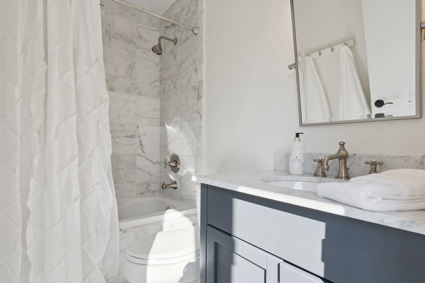 811 South Ridge Road Lake Forest, IL 60045 - Photo 27 of 47 a bathroom with a granite countertop sink a toilet and shower
