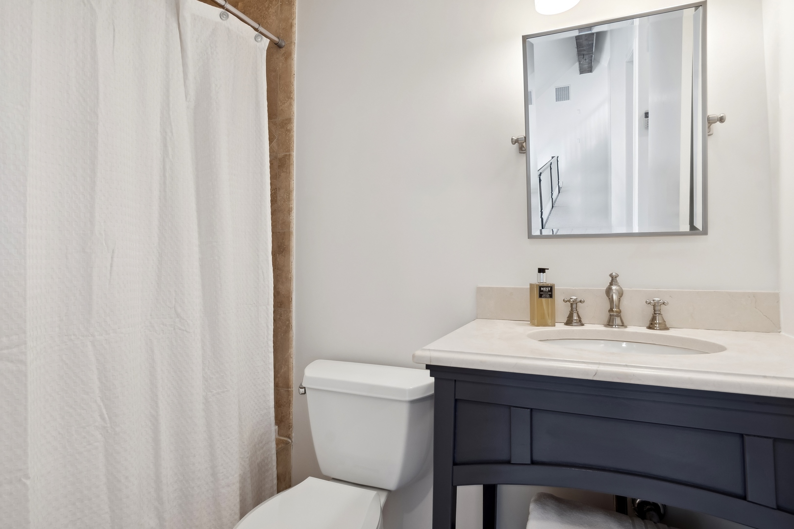 811 South Ridge Road Lake Forest, IL 60045 - Photo 29 of 47 a bathroom with a sink vanity mirror and toilet