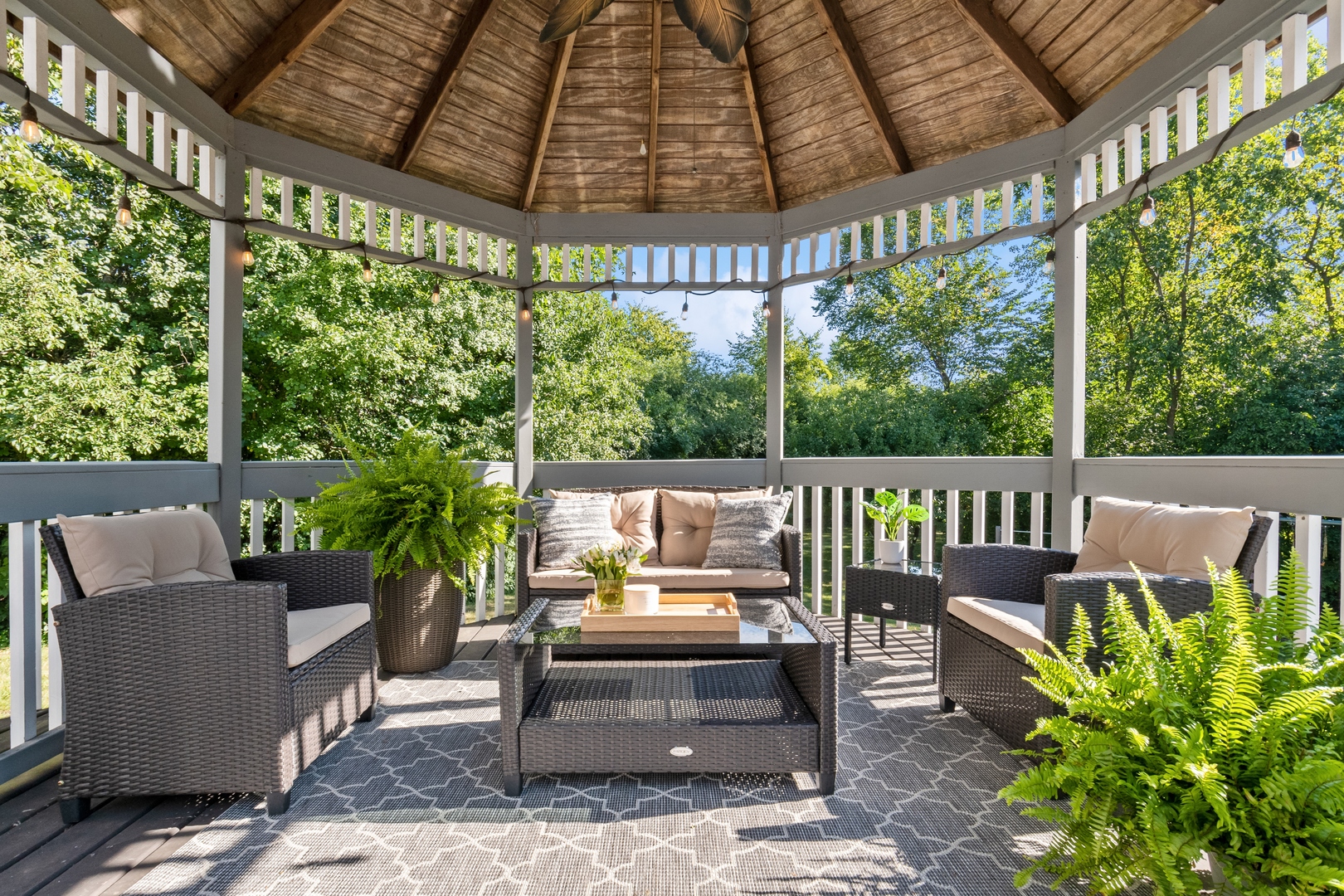 811 South Ridge Road Lake Forest, IL 60045 - Photo 41 of 47 a view of a patio with table and chairs potted plants with wooden floor