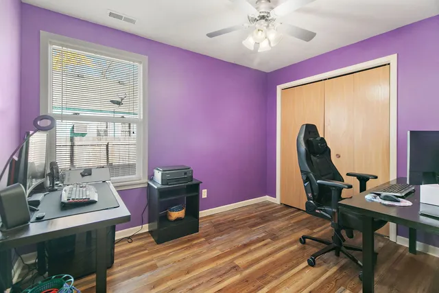 a workspace with furniture and wooden floor