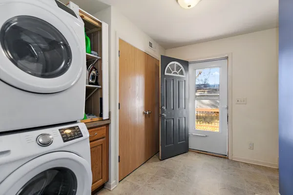 a view of livingroom with washer and dryer
