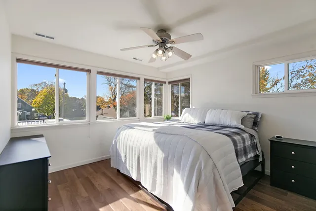 a bedroom with a large bed and a window