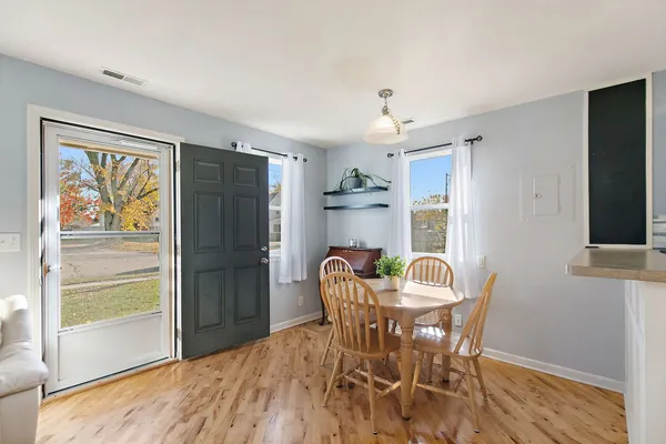 a dining room with furniture and window