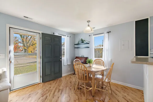 a dining room with furniture and window