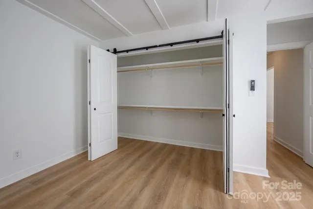 a view of balcony with wooden floor and fence