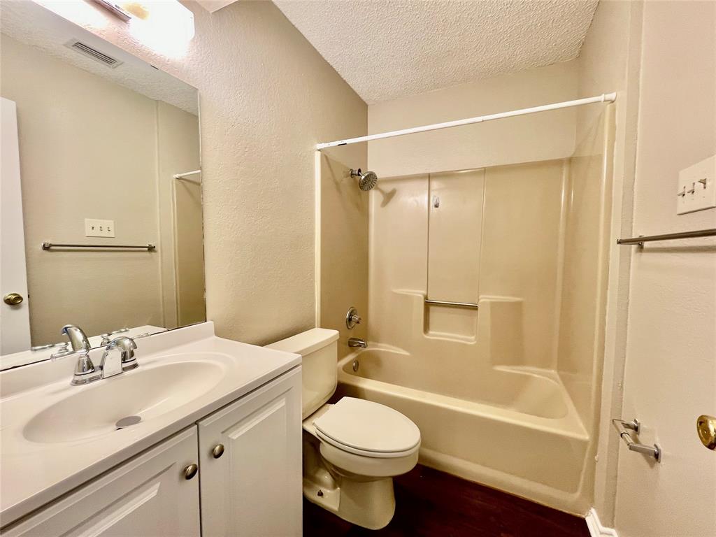 524 Strata Drive Denton, TX 76201 - Photo 11 of 17 a bathroom with a sink toilet and shower