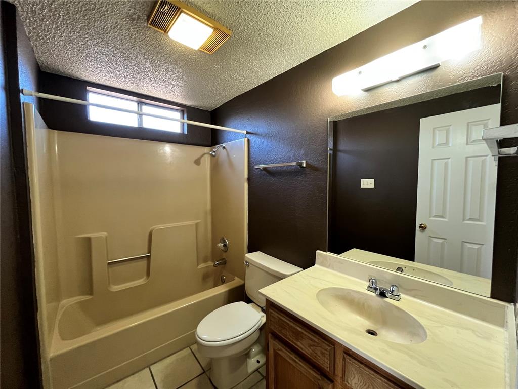 524 Strata Drive Denton, TX 76201 - Photo 14 of 17 Notice all of the lighting. Some of the lighting comes naturally through the windows, and the rest goes with the light fixtures.