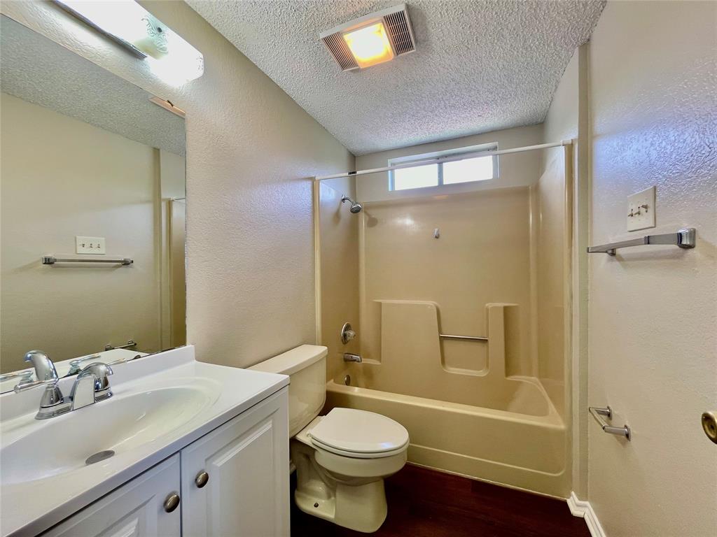 524 Strata Drive Denton, TX 76201 - Photo 16 of 17 a bathroom with a sink toilet and shower