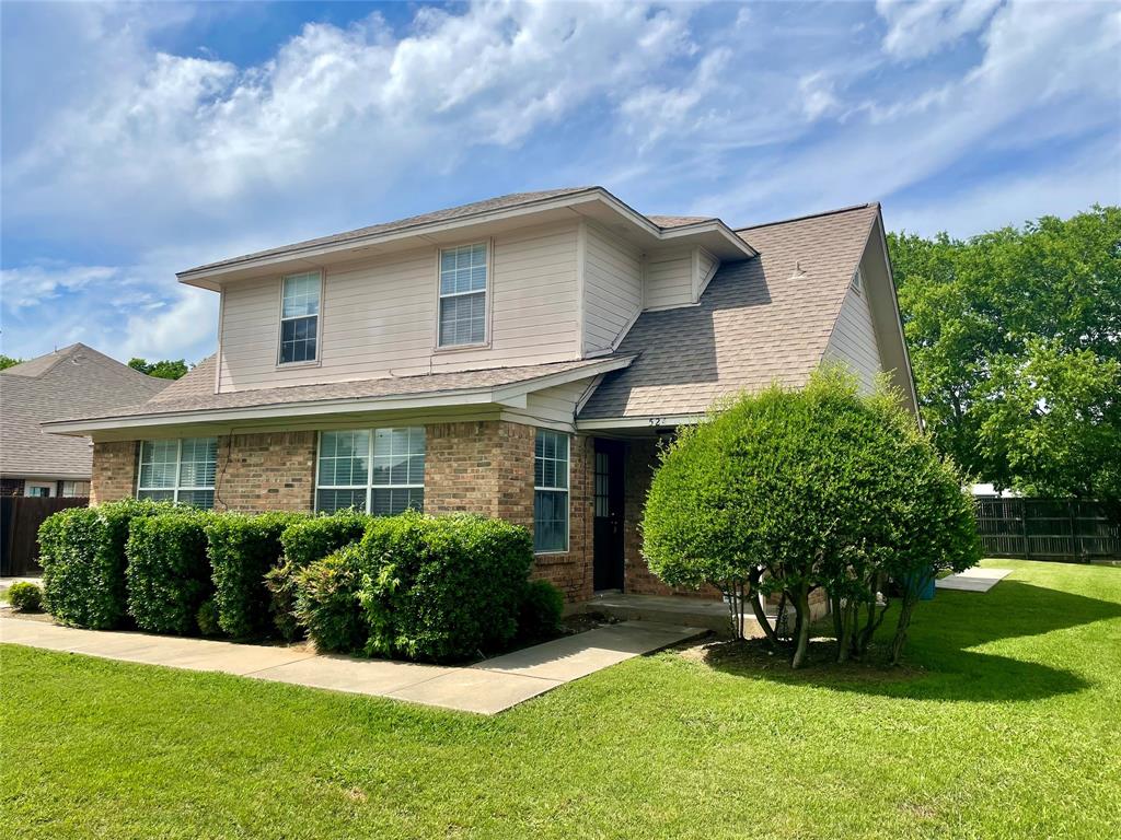 524 Strata Drive Denton, TX 76201 - Photo 2 of 17 a view of a house with a yard and plants