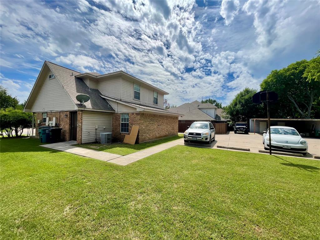 524 Strata Drive Denton, TX 76201 - Photo 3 of 17 a front view of a house with garden